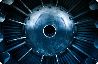 A photo of a jet engine, showcasing its intricate design and powerful machinery.